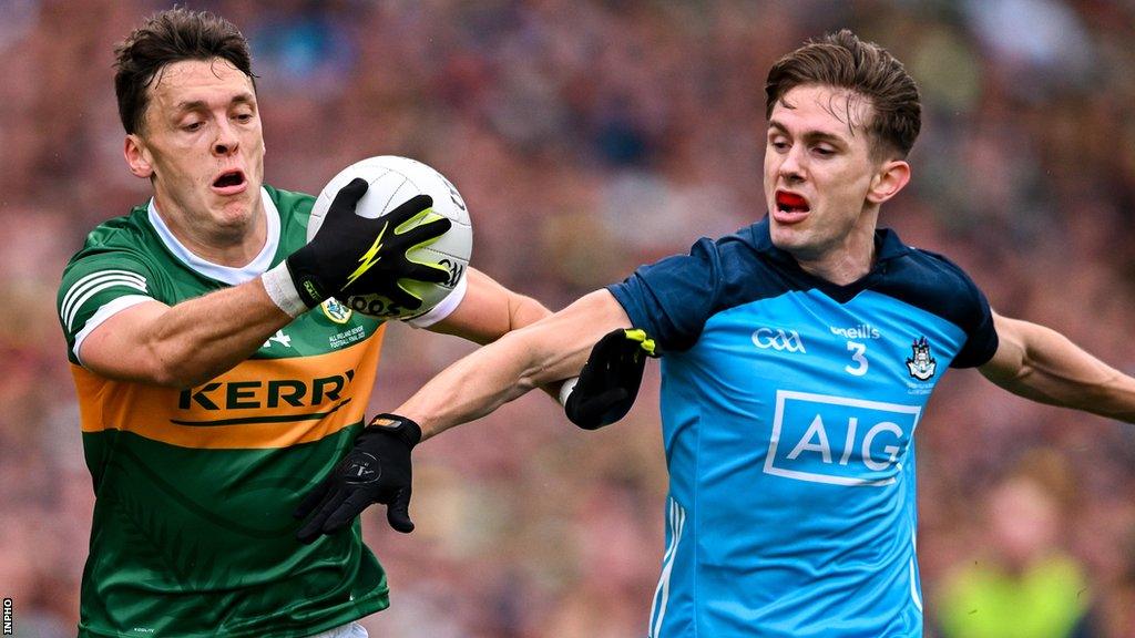 Clifford tries to run past Michael Fitzsimons during the All-Ireland final