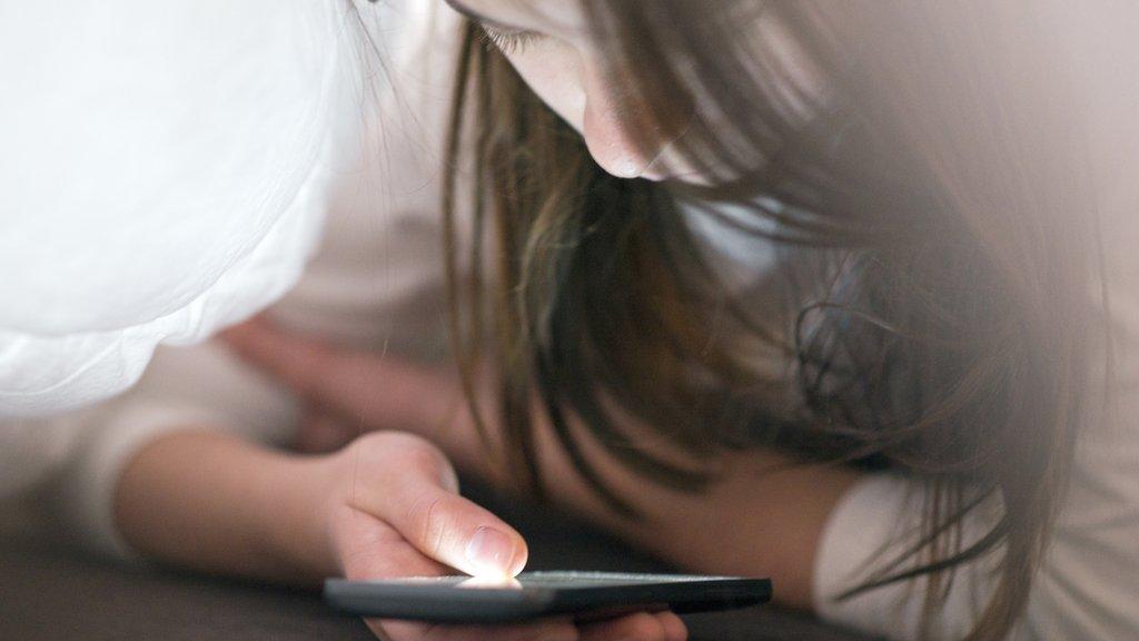 Teenage girl using a smartphone