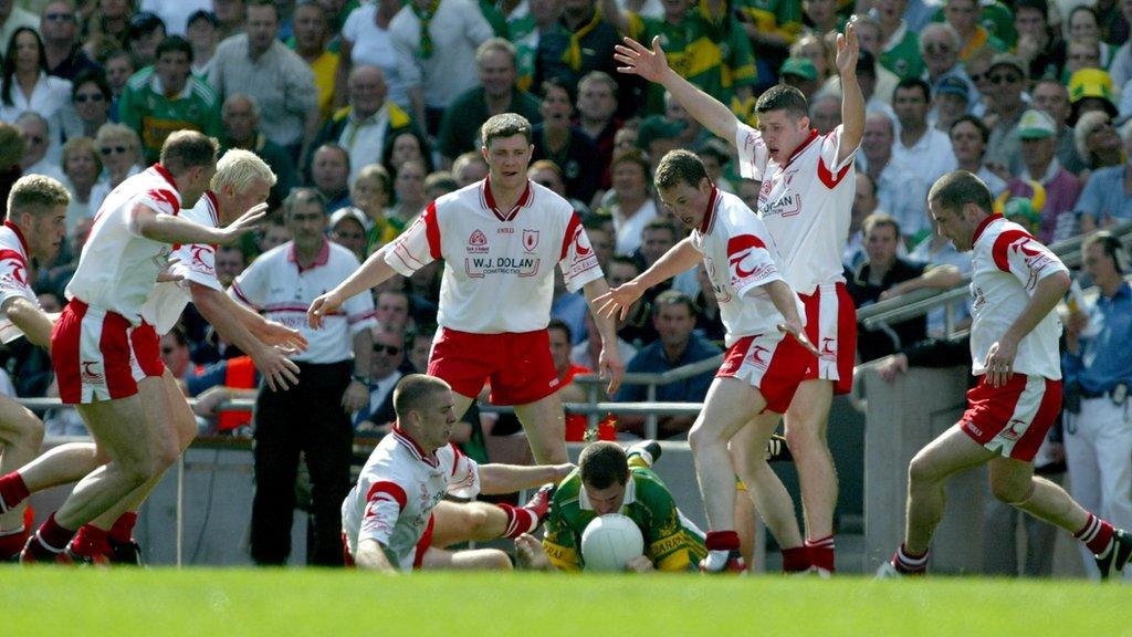 Kevin Hughes, Gerard Cavlan, Owen Mulligan, Ciaran Gourley, Enda McGinley, Gavin Devlin, Sean Cavanagh and Stephen O'Neill surround Kerry's Eoin Brosnan in the 2003 All-Ireland semi-final