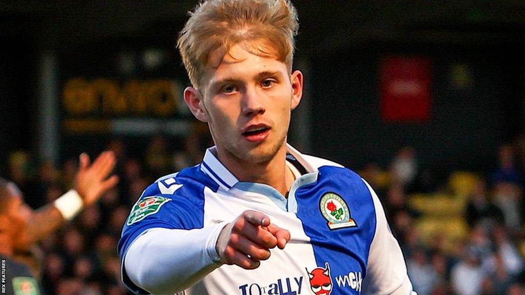 Jake Garrett celebrates scoring Blackburn's opening goal at Harrogate Town