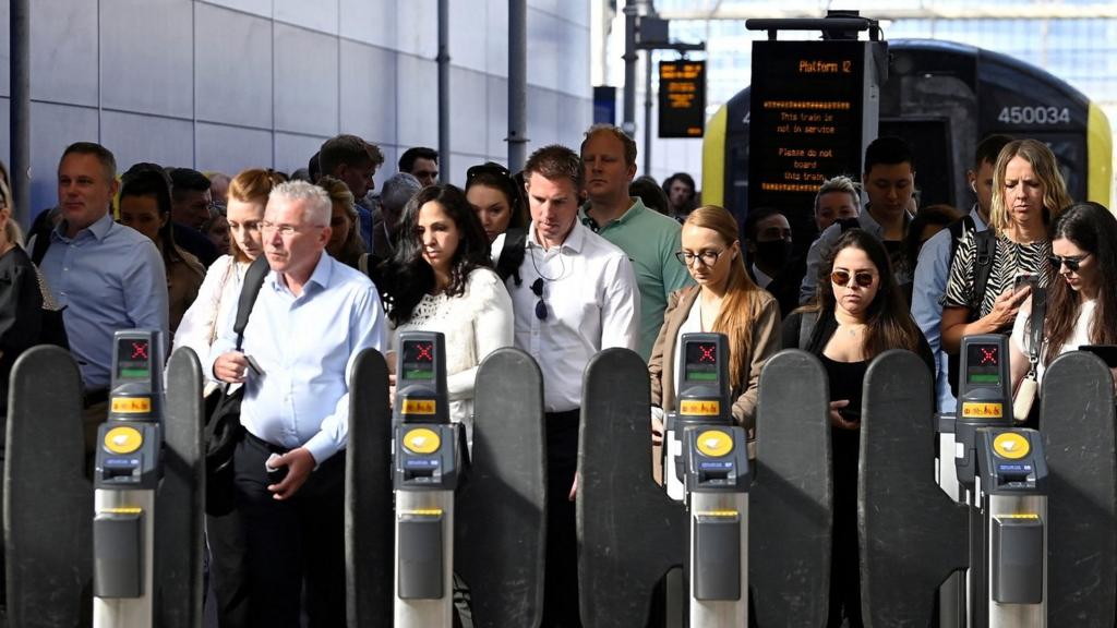 Passengers arrive during the morning rush-hour, ahead of a planned national strike by rail workers, at Waterloo Station, in London, Britain, 20 June 2022.