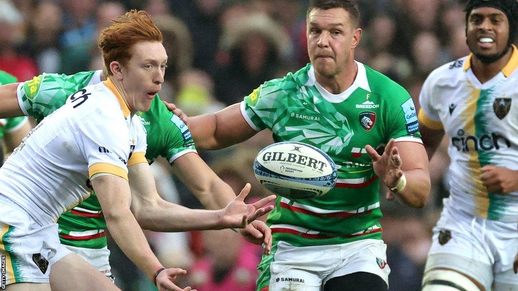 George Hendy of Northampton Saints passes the ball in their derby against Leicester