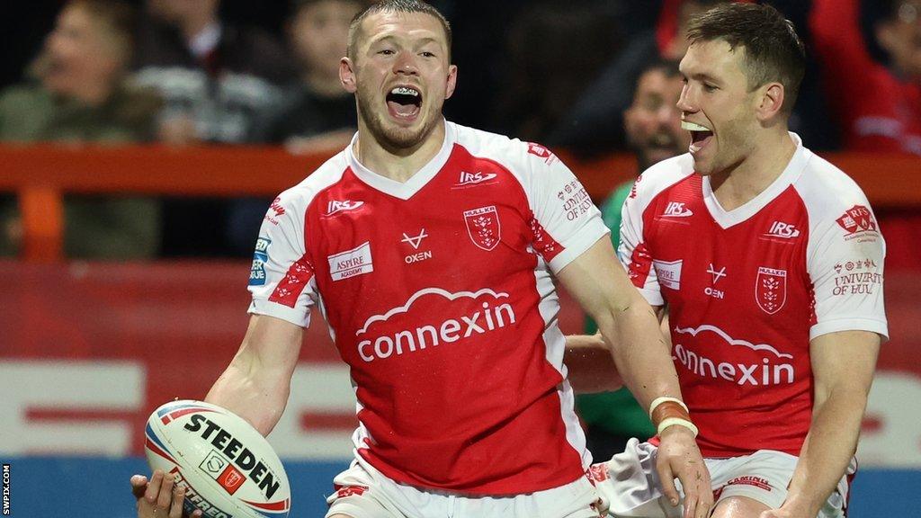 James Batchelor (left) celebrates a try for Hull KR