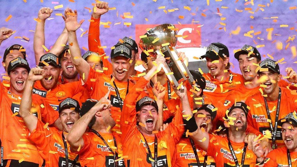 Perth Scorchers celebrate with the trophy after winning the 2021/22 Big Bash League