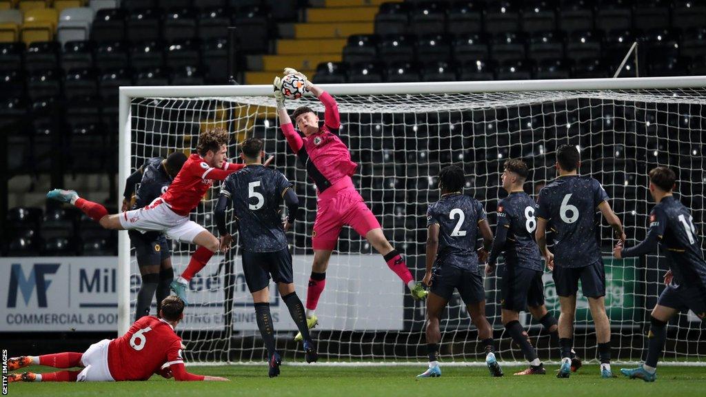 Cheltenham Town have signed goalkeeper, Jamie Pardington, after his release from the Irish Premiership champions Larne.