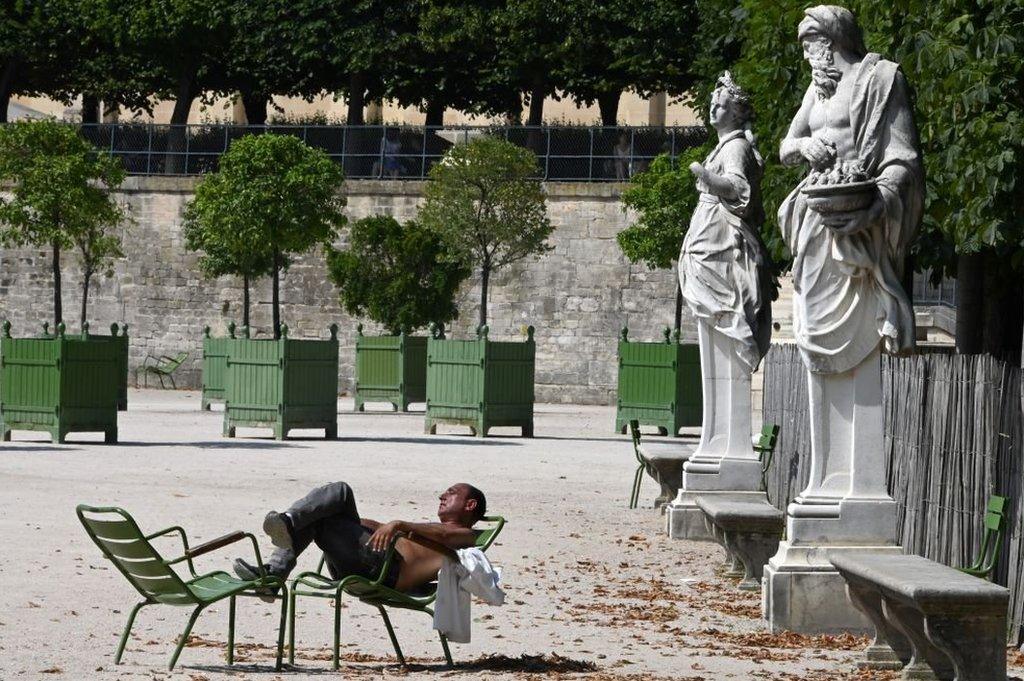 Man basks on chair