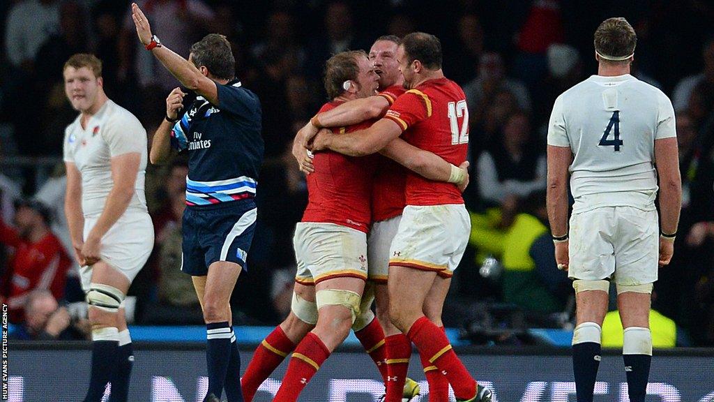 Jamie Roberts celebrates with Alun Wyn Jones and Gethin Jenkins after Wales defeated England at Twickenham