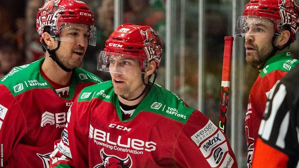 Justin Crandall celebrates with team-mates after scoring Cardiff Devils' opening goal