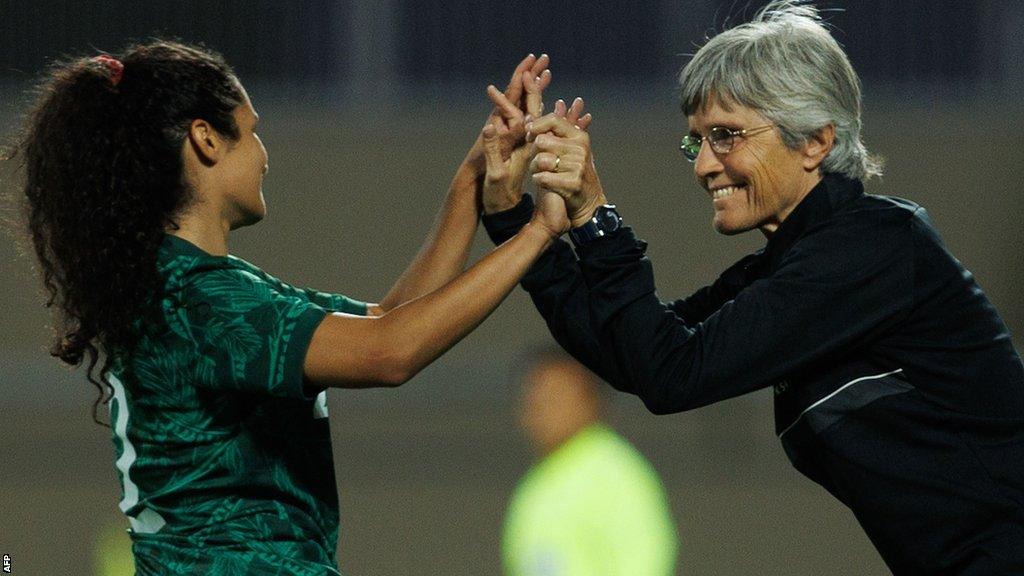 Saudi Arabia's Bayan Sadagah (L) celebrates her goal with her coach Monika Staab during a friendly football match between Saudi Arabia and Bhutan in September 2022