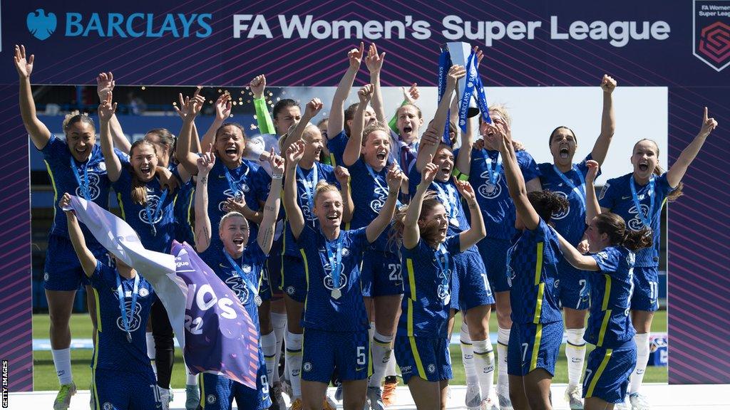 Chelsea celebrate with the WSL trophy