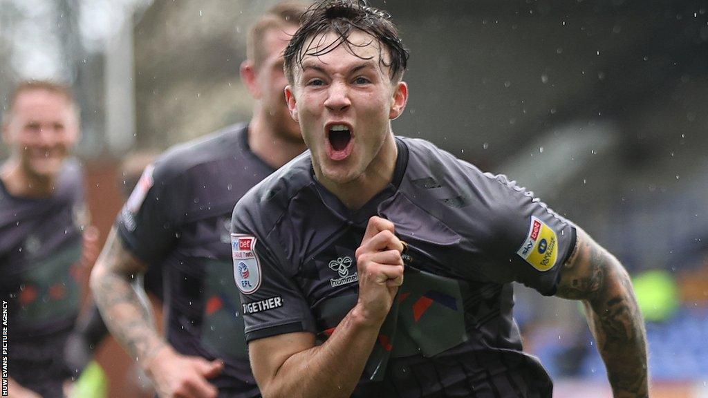 Charlie McNeill celebrates after scoring for Newport County against Tranmere Rovers