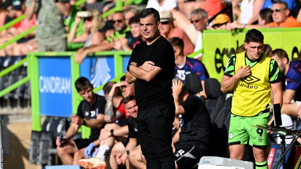 David Horseman stands with his arms folded on the sideline during Forest Green's defeat to Crewe