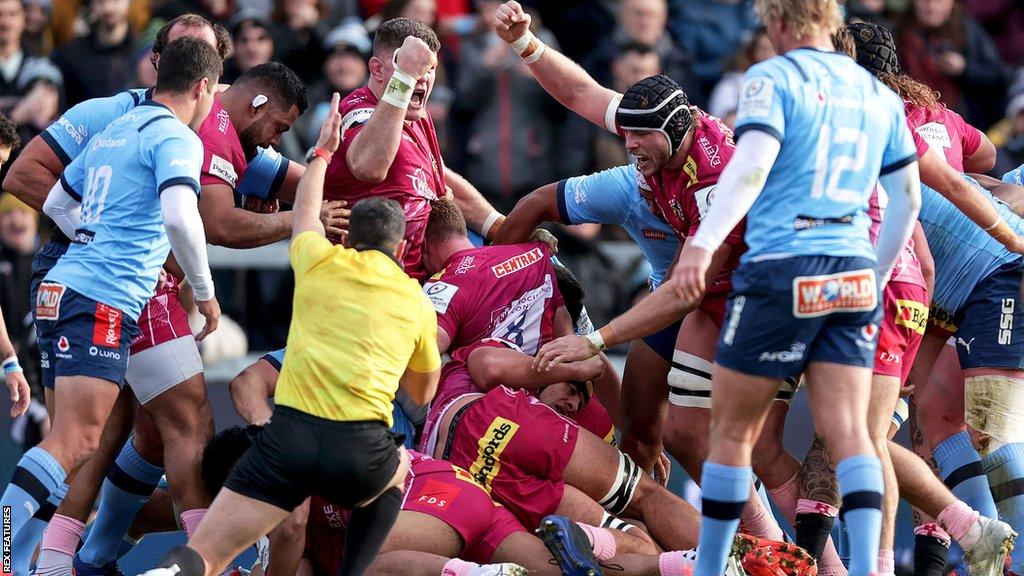 Exeter celebrate a try against Bulls