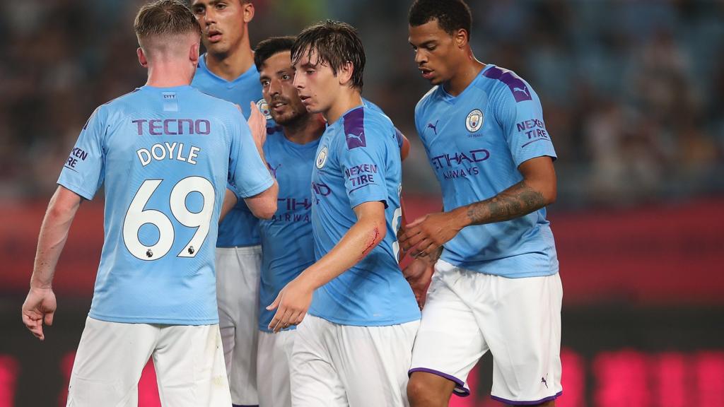 Man City players celebrate