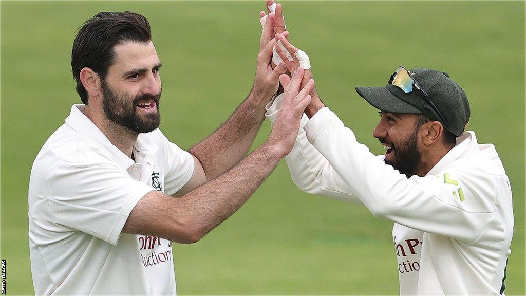 Brett Hutton celebrates with Haseeb Hameed