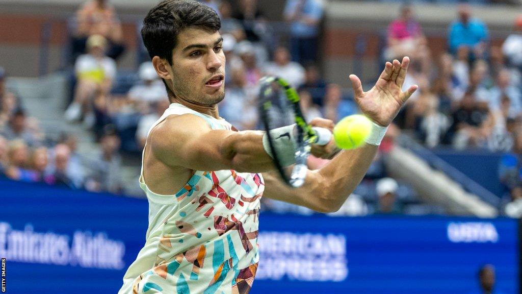 Carlos Alcaraz playing a forehand during his win