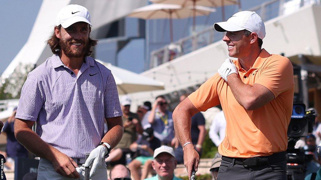 Tommy Fleetwood and Rory McIlroy share a smile on the first tee in Sunday's final round