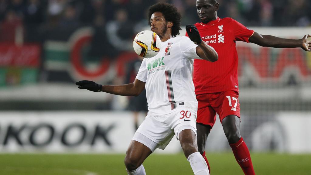 Caiuby and Liverpool's Mamadou Sakho in action