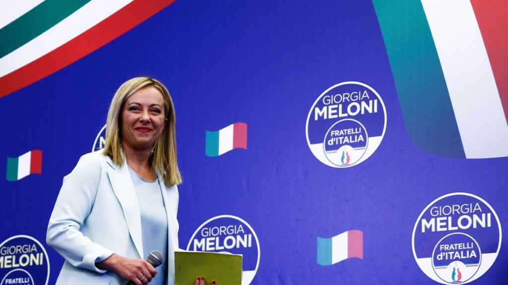 Leader of Brothers of Italy Giorgia Meloni looks on as she walks on the stage at the party's election night headquarters, in Rome, Italy September 26, 2022