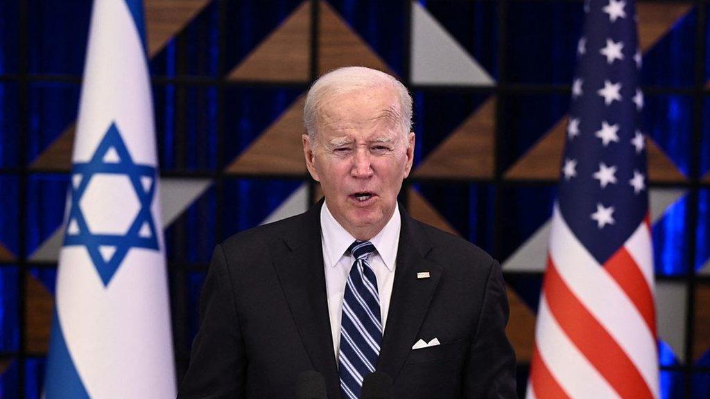 Biden flanked by Israel and US flag