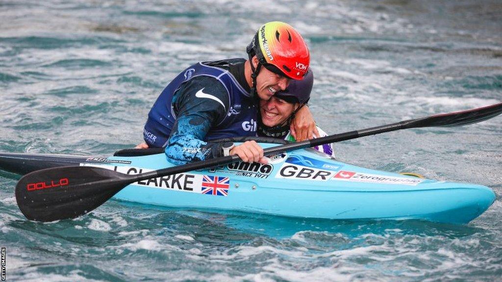 Kimberley Woods and Joe Clarke celebrate together after both winning gold on the final day of the 2023 ICF Canoe Slalom World Championships