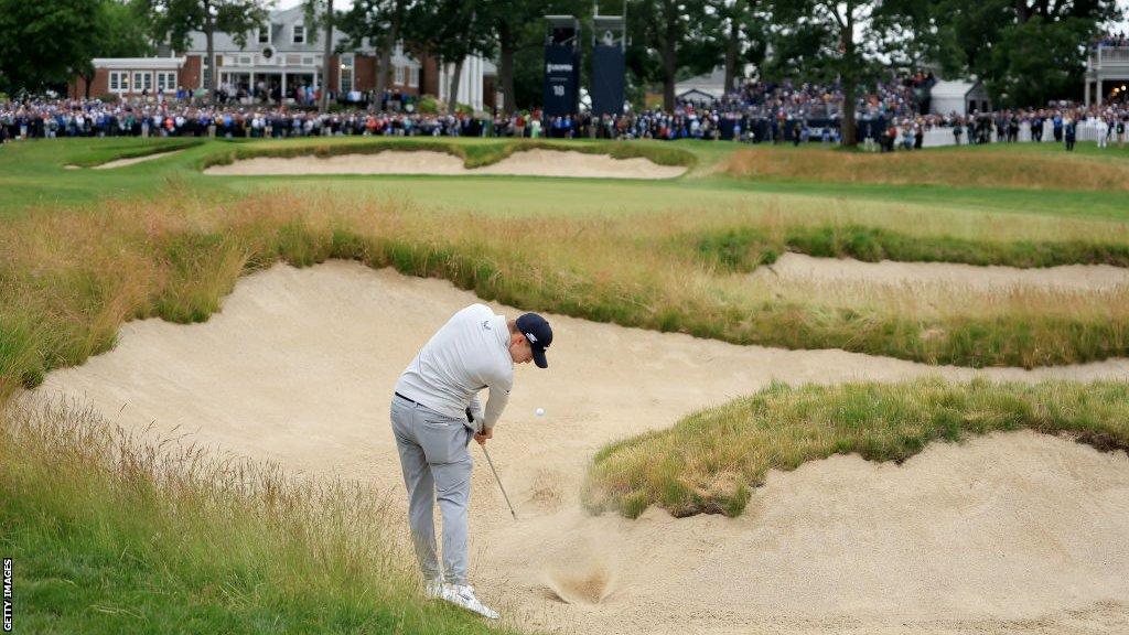 England's Matt Fitzpatrick hits a bunker shot on the final hole of the 2022 US Open on his way to winning the title