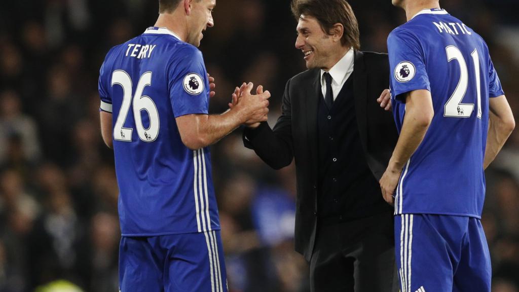 John Terry and Antonio Conte shake hands