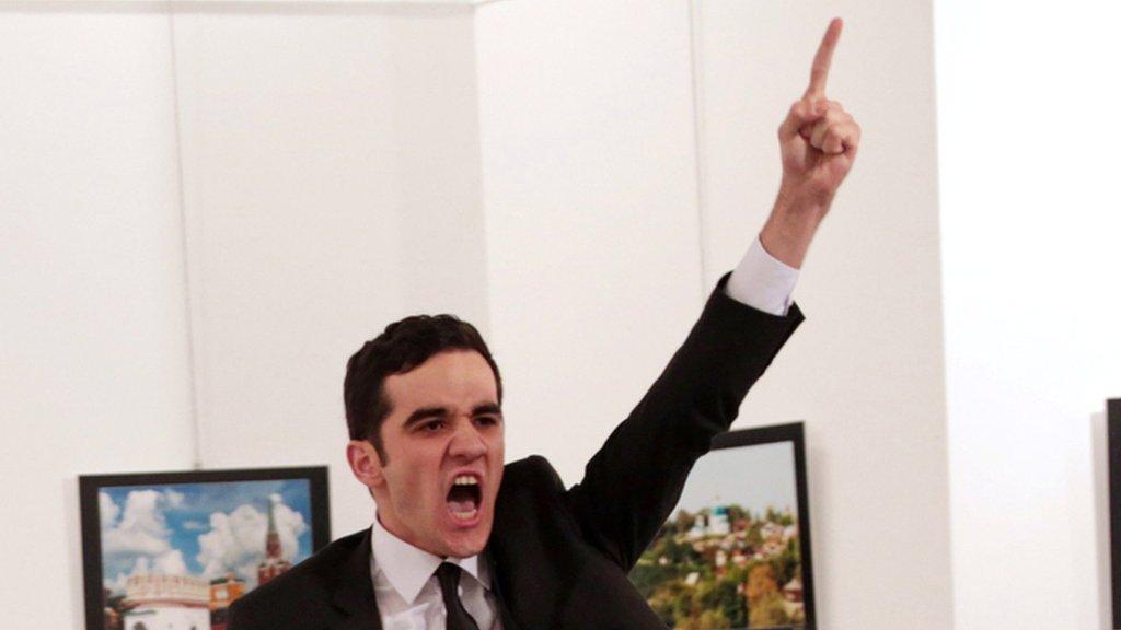 Mevlut Mert Altintas shouts after shooting Andrei Karlov the Russian ambassador to Turkey, at an art gallery in Ankara, Turkey, 19 December 2016.