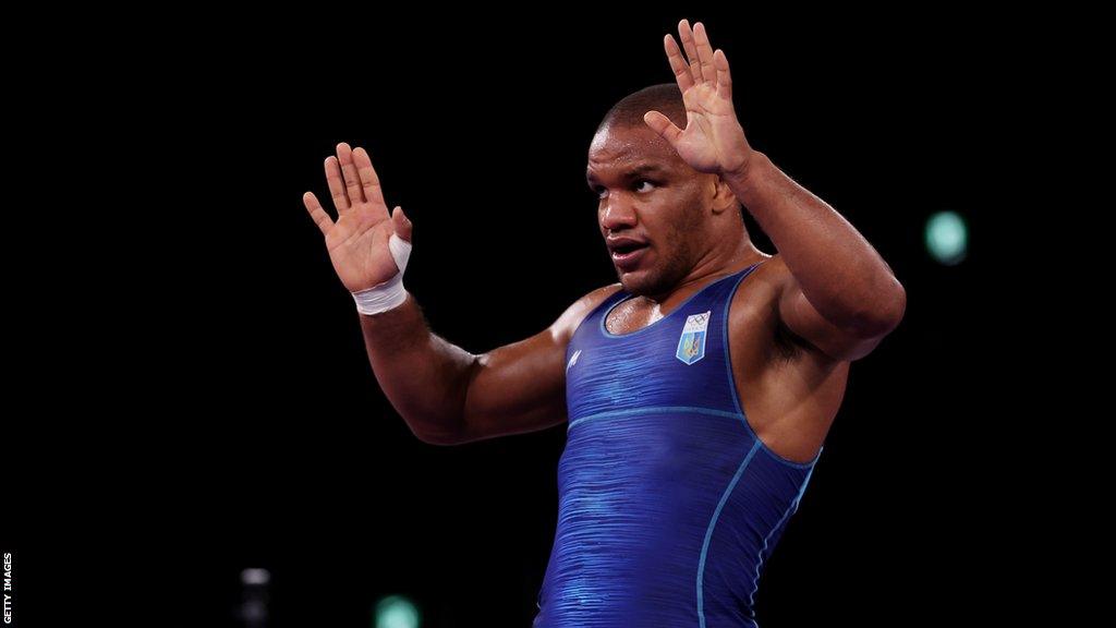 Ukrainian wrestler Zhan Beleniuk celebrates winning gold at the 2020 Olympics in Tokyo