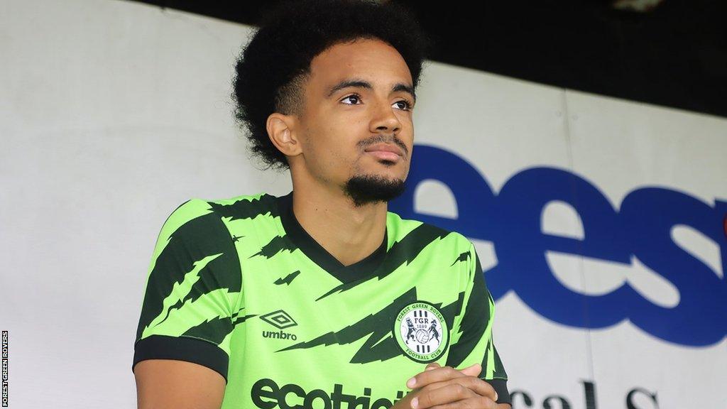 Jacob Maddox poses in a Forest Green Rovers shirt during his unveiling by the League Two club