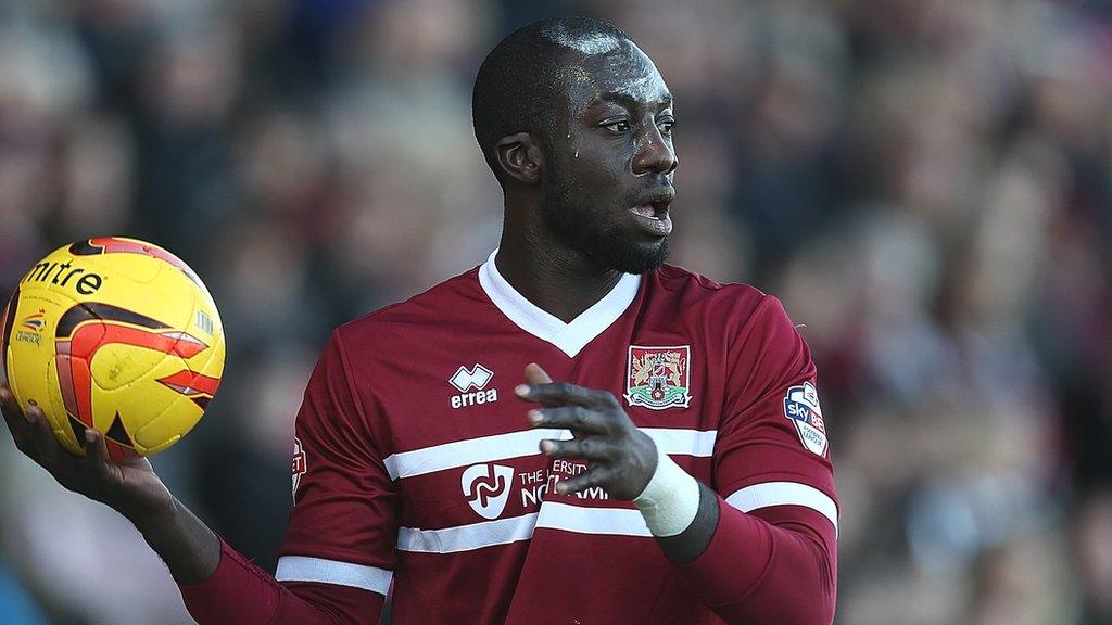 Kevin Amankwaah prepares to take a throw-in while playing for Northampton Town