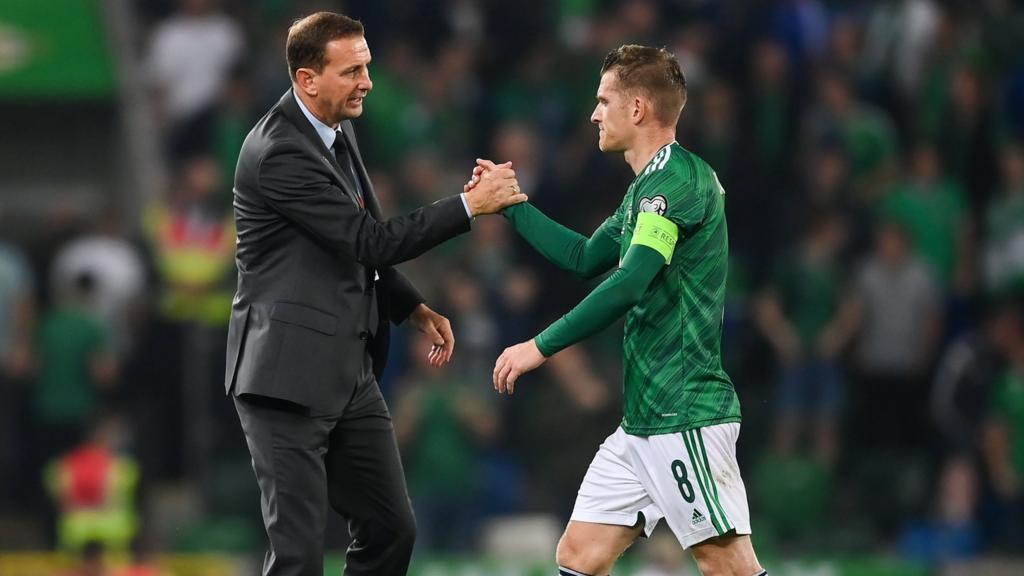 Steven Davis & Ian Baraclough shake hands