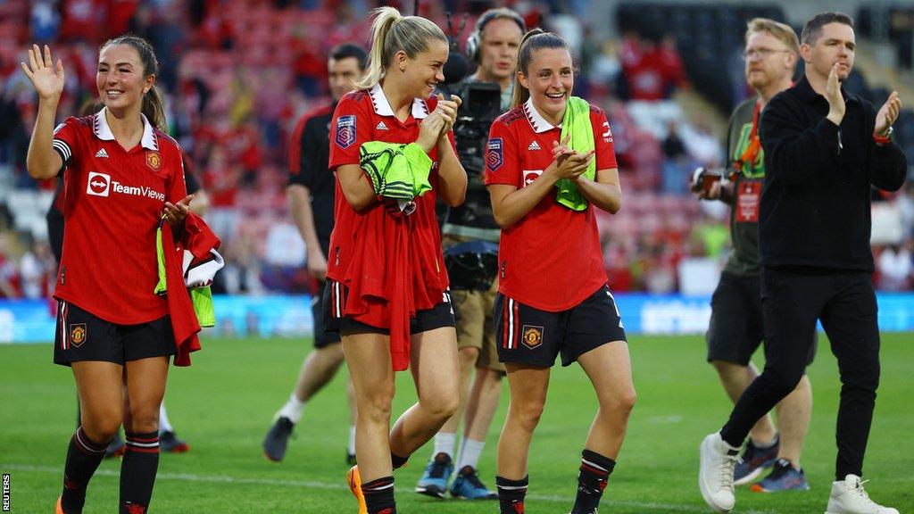 Katie Zelem, Alessia Russo, Ella Toone and Marc Skinner applaud the crowd