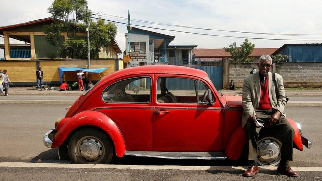 Siyum Haile, 72, a retired United Nations (UN) employee and Jehovah's Witness, poses for a photograph next to his 1977 model Volkswagen Beetle car in Addis Ababa, Ethiopia - 16 September 2017 - photo published 27 October 2017