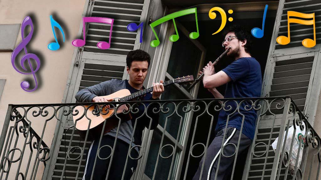 musicians-play-guitar-and-flute-on-their-balcony-during-coronavirus-self-isolation.