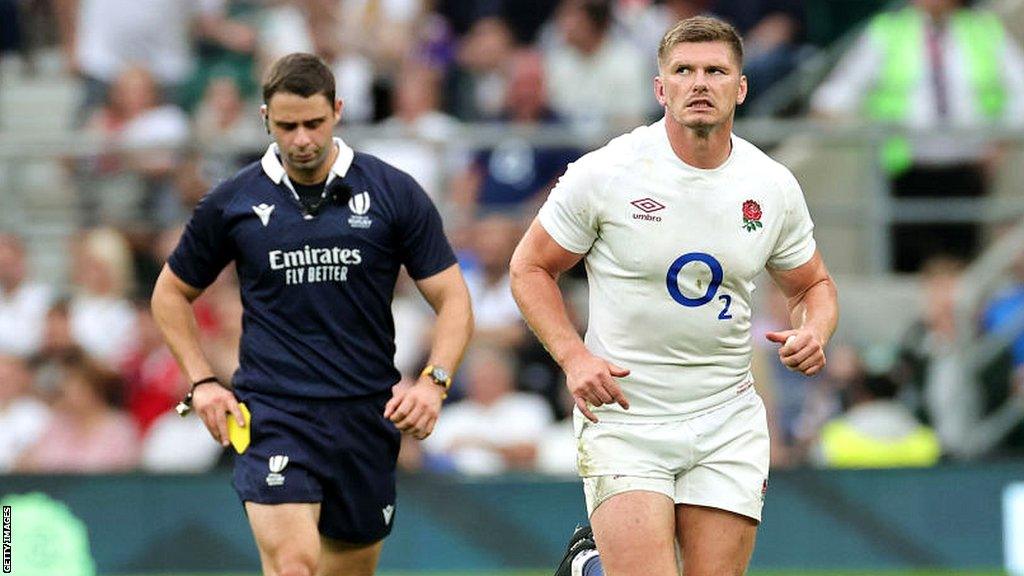 Owen Farrell leaves the field after being shown a yellow card, later escalated to a red, by referee Nika Amashukeli