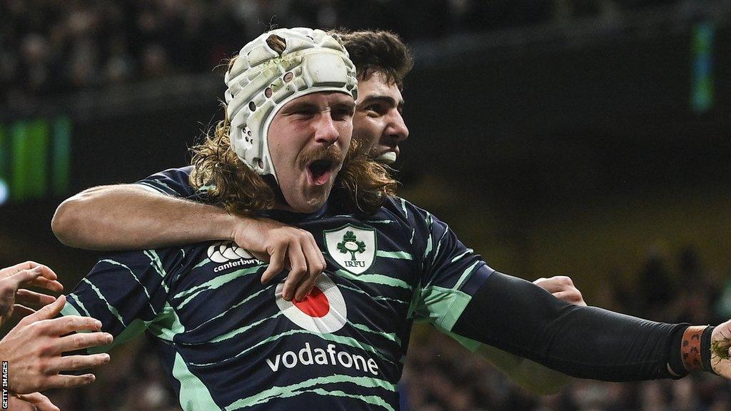 Mack Hansen celebrates his try against South Africa