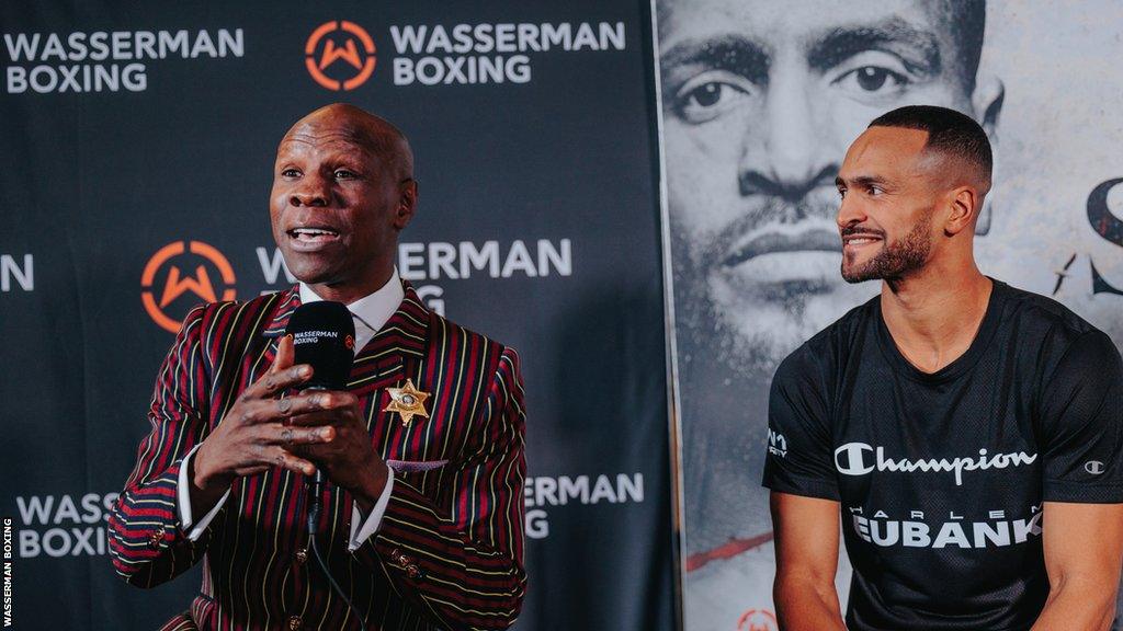 Chris Eubank Sr speaks beside Harlem Eubank at a news conference