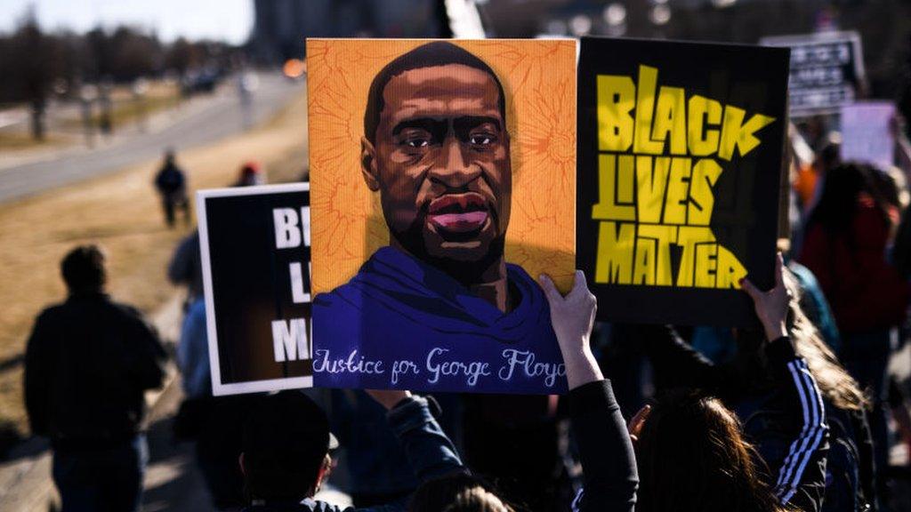 People march near the Minnesota State Capitol to honor George Floyd on 19 March 2021