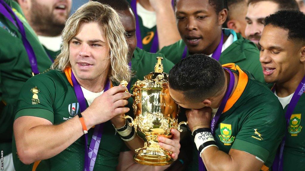 Faf de Klerk with the World Cup trophy in 2019