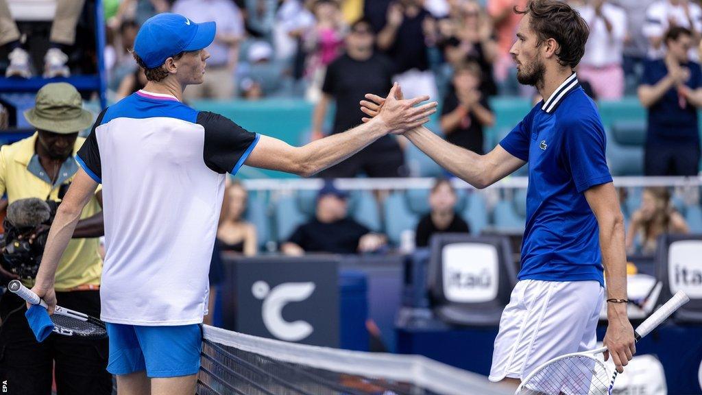 Jannik Sinner and Daniil Medvedev shake hands at the net after the match