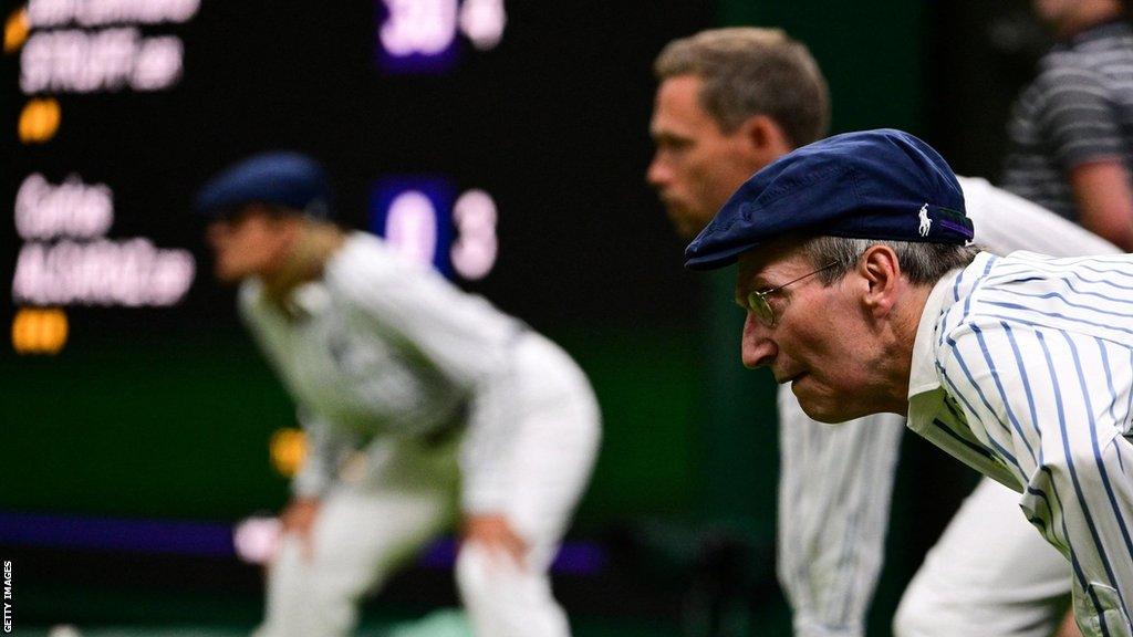 Tennis line judges during a match at 2022 Wimbledon