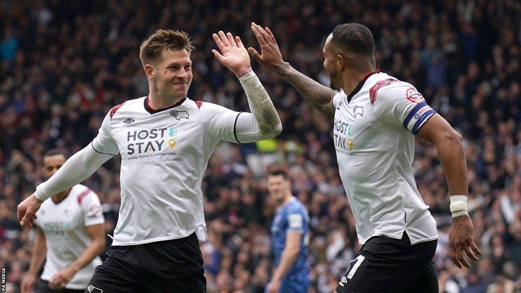 James Collins (left) high-fives Nathaniel Mendez-Laing after putting Derby 2-0 up against Carlisle