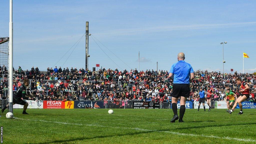 Pat Havern beats Donegal goalkeeper Shaun Patton from the penalty spot at Pairc Esler