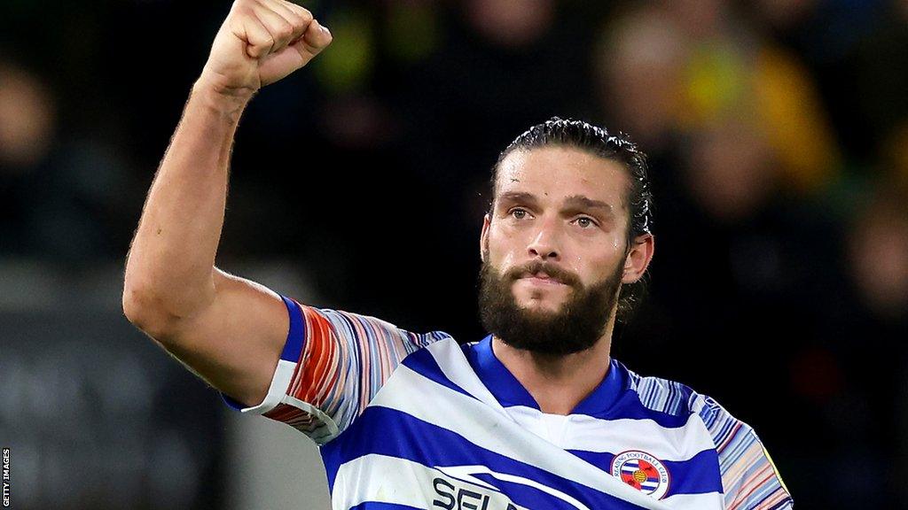 Andy Carroll raises a fist in the air on Reading duty