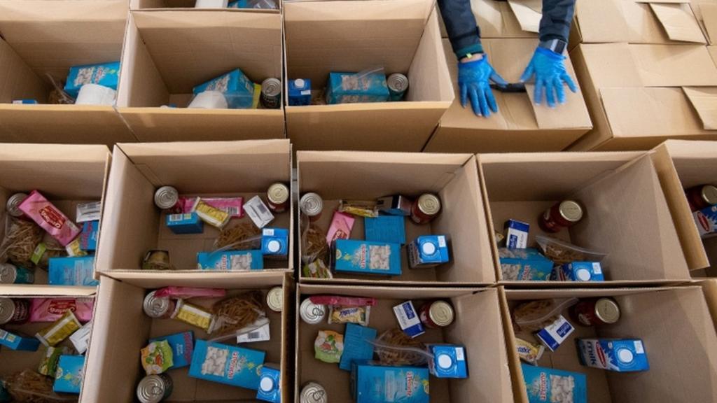 Birmingham City Council staff prepare the first food parcels to be distributed to the city's vulnerable population