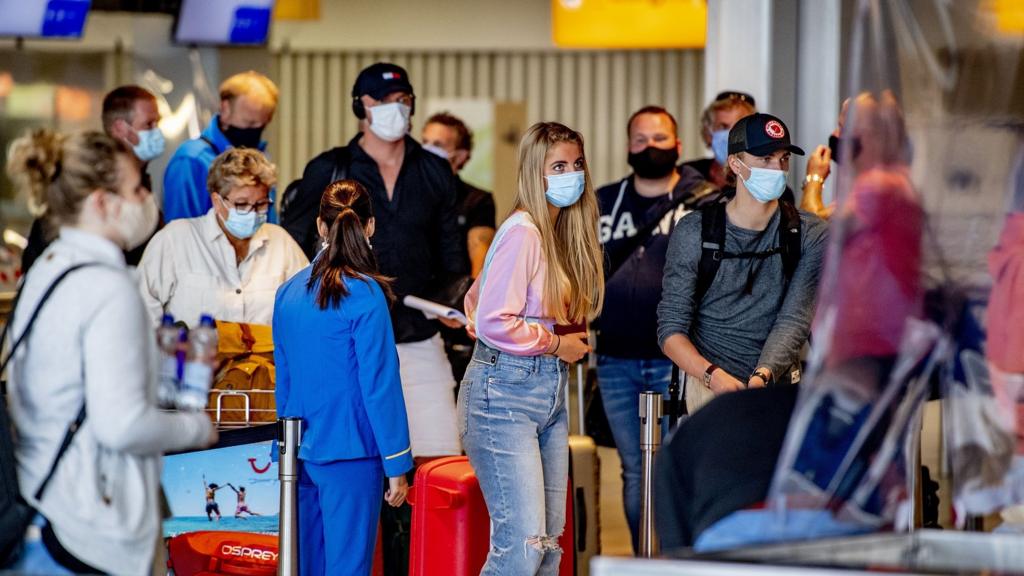 Traveller walking at Schiphol airport 13 August