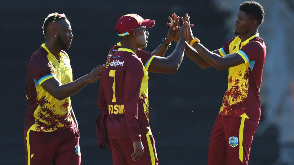 West Indies players celebrate a wicket