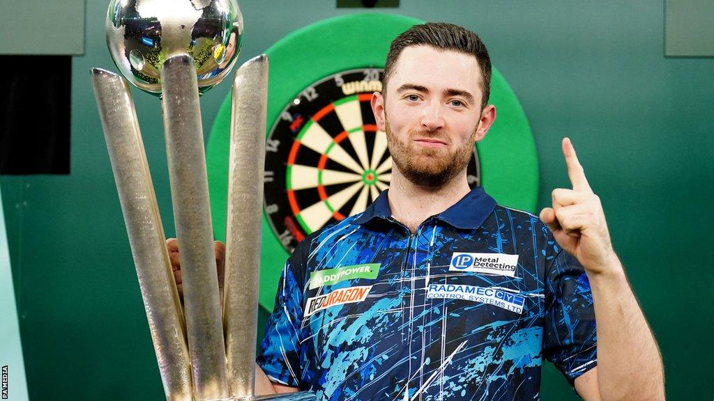 Luke Humphries celebrates winning the PDC World Darts Championship