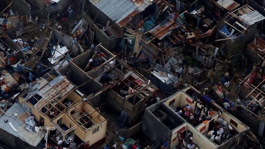 Aerial images show homes badly destroyed, some without roofs, in the southern town of Jeremie